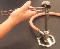 A metal striker can also be used to light a Bunsen burner.