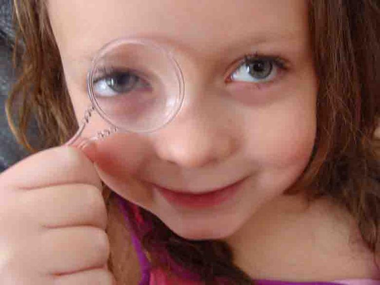 girl with magnifying glass