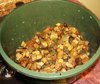 Use a clean pot with draining holes as a sieve in which you can wash potting stones and rocks.